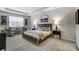 Relaxing main bedroom with a large bed, a seating area, and a window for natural light at 2534 Crimson Way, Monroe, NC 28112