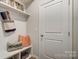 Convenient mudroom with storage shelves, hooks, and stylish accents at 2534 Crimson Way, Monroe, NC 28112
