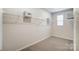 Spacious walk-in closet with carpeted floors and wire shelving for maximum storage and organization at 2534 Crimson Way, Monroe, NC 28112