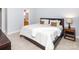 Comfortable bedroom featuring tile flooring and view into the bathroom at 2627 Bridgeville Ln, Charlotte, NC 28262
