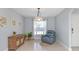 Bright dining area featuring neutral walls, tile flooring, and a large window for ample natural light at 2627 Bridgeville Ln, Charlotte, NC 28262