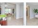 Open-concept foyer with neutral tile, arched doorways, and a view into the adjacent dining and living areas at 2627 Bridgeville Ln, Charlotte, NC 28262