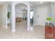 Spacious foyer with neutral tile flooring, elegant archways, and plenty of natural light at 2627 Bridgeville Ln, Charlotte, NC 28262