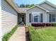 Close-up of the front entrance featuring a charming front door, neat landscaping, and well-maintained siding at 2627 Bridgeville Ln, Charlotte, NC 28262