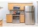 Kitchen with stainless appliances including refrigerator, microwave, and stove oven at 2627 Bridgeville Ln, Charlotte, NC 28262