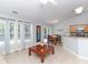 Inviting living room featuring tile floors, large windows, and an adjacent dining area for seamless entertaining at 2627 Bridgeville Ln, Charlotte, NC 28262