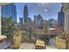 City view from an outdoor balcony with seating at 300 W 5Th St # 711, Charlotte, NC 28202