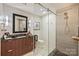 Bathroom featuring a modern vanity with unique hardware and a glass-enclosed shower at 300 W 5Th St # 711, Charlotte, NC 28202