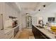 Bright open kitchen with island seating, sleek cabinets, and stainless steel appliances at 300 W 5Th St # 711, Charlotte, NC 28202