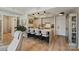 Well-lit kitchen features an island with seating, modern cabinets, and stainless steel appliances at 300 W 5Th St # 711, Charlotte, NC 28202