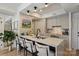 Well-lit kitchen features an island with seating, modern cabinets, and stainless steel appliances at 300 W 5Th St # 711, Charlotte, NC 28202