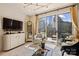 Bright living room with a view of the city skyline from the balcony and stylish decor at 300 W 5Th St # 711, Charlotte, NC 28202