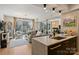 Living Room view featuring a balcony, modern furniture, and ample natural light at 300 W 5Th St # 711, Charlotte, NC 28202