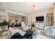 Modern open-concept layout with a kitchen island, hardwood flooring, and contemporary furniture at 300 W 5Th St # 711, Charlotte, NC 28202