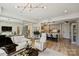 Open-concept living space with modern kitchen, sleek furniture, hardwood floors, and stylish decor at 300 W 5Th St # 711, Charlotte, NC 28202