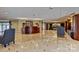 Open lobby with reception desk, armchairs, and elegant tiled floors at 300 W 5Th St # 711, Charlotte, NC 28202