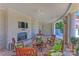 Comfortable outdoor lounge with a fireplace, TV, and ample seating area at 300 W 5Th St # 711, Charlotte, NC 28202