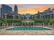 Resort-style pool area with a gazebo and lounge chairs in a luxury community with a skyline view at 300 W 5Th St # 711, Charlotte, NC 28202