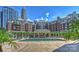 Beautiful outdoor pool area with a gazebo and lounge chairs, set against a city skyline at 300 W 5Th St # 711, Charlotte, NC 28202