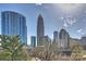 City skyline with architectural buildings towering over treetops at 300 W 5Th St # 711, Charlotte, NC 28202