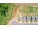 Drone shot of a single-story home with an expansive backyard in a suburban neighborhood at 324 Aniston Ln, Shelby, NC 28152