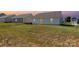 Spacious backyard featuring a gently sloping lawn with a sliding glass door at 324 Aniston Ln, Shelby, NC 28152