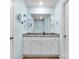 Bathroom with blue walls, white vanity with granite countertop, and a large mirror at 324 Aniston Ln, Shelby, NC 28152