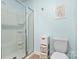 Bathroom with a glass shower, white toilet, and a decorative storage cabinet at 324 Aniston Ln, Shelby, NC 28152