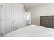 Bright bedroom featuring double closets and doorway leading to a sunny area at 324 Aniston Ln, Shelby, NC 28152