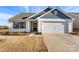 Charming one-story home featuring a two-car garage and neatly landscaped front yard at 324 Aniston Ln, Shelby, NC 28152