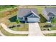 Aerial view of a single-story home with a well-maintained lawn and concrete driveway at 324 Aniston Ln, Shelby, NC 28152