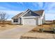Single-story home with a well-manicured lawn and spacious driveway at 324 Aniston Ln, Shelby, NC 28152