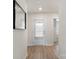 Hallway with hardwood floors, a front door with blinds, and neutral paint at 324 Aniston Ln, Shelby, NC 28152
