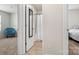 Hallway showcasing entrances to the bath, bedroom, and additional room at 324 Aniston Ln, Shelby, NC 28152