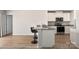 Bright kitchen features granite countertops, stainless steel appliances, and breakfast bar with seating at 324 Aniston Ln, Shelby, NC 28152