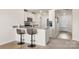 Bright eat-in kitchen features granite countertops and breakfast bar at 324 Aniston Ln, Shelby, NC 28152
