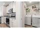 Modern kitchen with stainless steel appliances and built-in laundry area at 324 Aniston Ln, Shelby, NC 28152