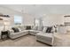 Comfortable living area with a large sectional sofa and view of the backyard at 324 Aniston Ln, Shelby, NC 28152