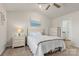 Bright main bedroom featuring vaulted ceiling, ceiling fan and ensuite bathroom at 324 Aniston Ln, Shelby, NC 28152