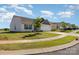 A charming single-story home on a street with well-kept lawns and young trees at 324 Aniston Ln, Shelby, NC 28152
