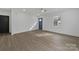 Bright living room featuring light wood floors, fresh paint, and a vibrant blue front door at 345 Grice St, Shelby, NC 28150