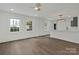 Inviting living space with light wood flooring, abundant natural light, and a view of the kitchen at 345 Grice St, Shelby, NC 28150