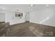 Open floor plan living room with light-colored walls and new flooring, adjacent to the kitchen at 345 Grice St, Shelby, NC 28150