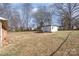 Expansive backyard with a storage shed and mature trees at 437 Valley St, Stanley, NC 28164