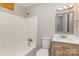 Bathroom featuring a shower and tub combination, toilet, and sink at 437 Valley St, Stanley, NC 28164