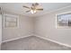 Comfortable bedroom with neutral walls, new carpet, ceiling fan, and window at 437 Valley St, Stanley, NC 28164