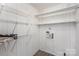 Practical laundry room with shelving and space for laundry machines at 437 Valley St, Stanley, NC 28164
