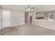 Inviting living room showcasing gray carpet, pass-through to kitchen, a white door and neutral paint at 437 Valley St, Stanley, NC 28164