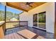 Back deck with a view of the lawn featuring a ceiling fan, wood flooring, and sliding glass doors to the home's interior at 453 Cedar Grove Rd, Clover, SC 29710