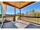Back deck featuring wood flooring and railings with a view of an expansive backyard at 453 Cedar Grove Rd, Clover, SC 29710